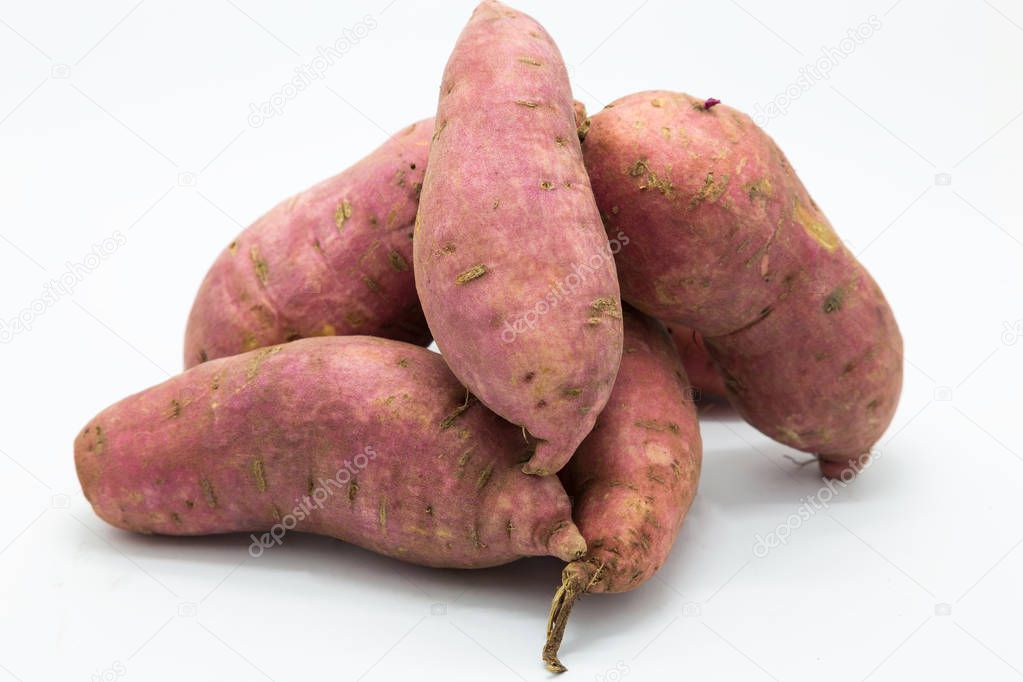 Purple fresh sweet potato on white 