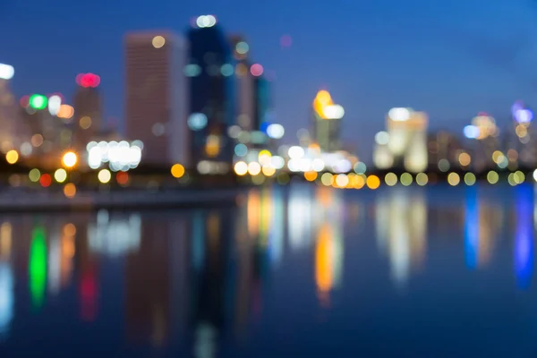 Twilight blurred bokeh city downtown with reflection — Stock Photo, Image