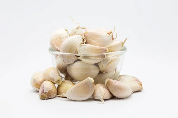 Garlic on glass cup — Stock Photo, Image