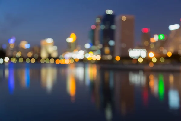 Night twilight blurred bokeh office building with reflection — Stock Photo, Image