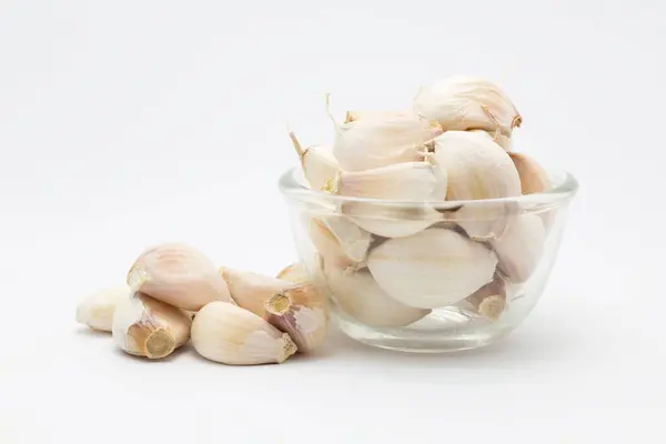Garlic on glass bowl — Stock Photo, Image