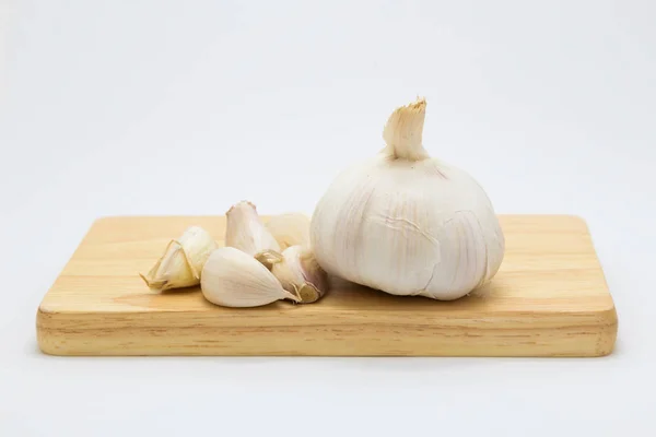 Garlic on wooden board — Stock Photo, Image