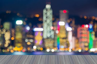 Açılış ahşap zemin, bulanık gece ışık Hong Kong iş şehir merkezinde, arka plan