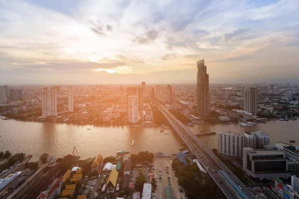 River cross over city business downtown with sunset sky background, cityscape background