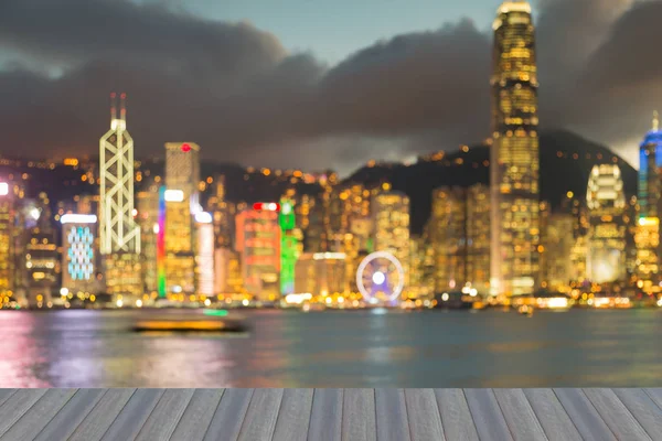Opening wooden floor, Night blurred bokeh Hong Kong downtown abstract background