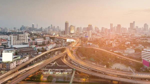 Highway interchange in city business downtown, cityscape background