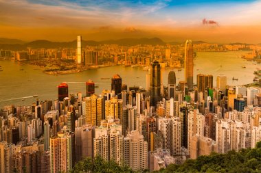 Hong Kong şehir iş şehir havadan görünümü, cityscape arka plan üzerinde günbatımı sesi