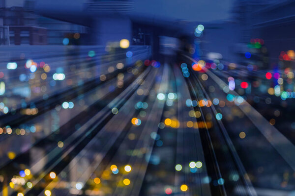 Blurred motion train track double exposure night blurred light, abstract background