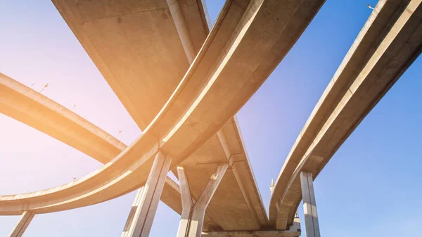 Bottom view Highway interchange against blue sky background