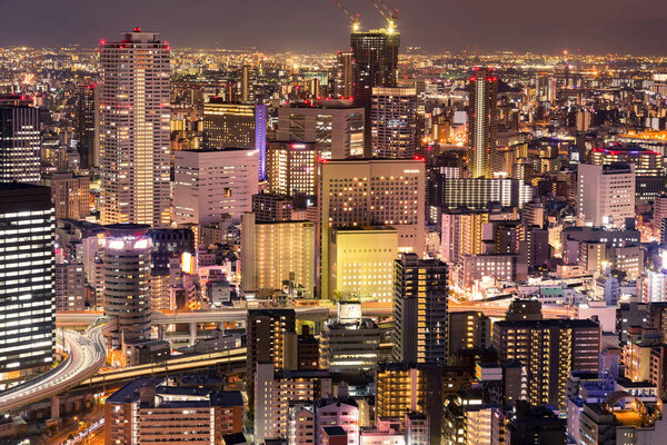 Night city crowded building skyline Osaka Japan, cityscape background