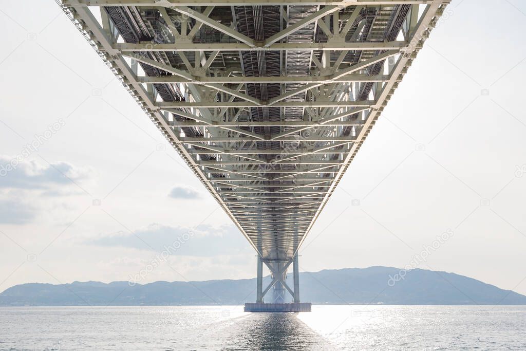Under steel bridge construction over sea coast, Akashi Kaikyo suspension bridge, Kobe Japan