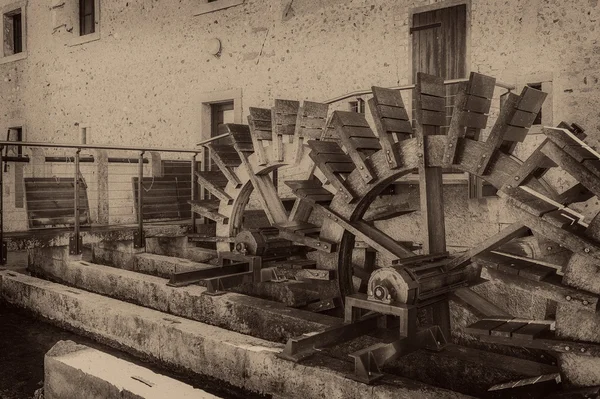 stock image Old wheels of a watermill. Vintage style picture. Adding grain t