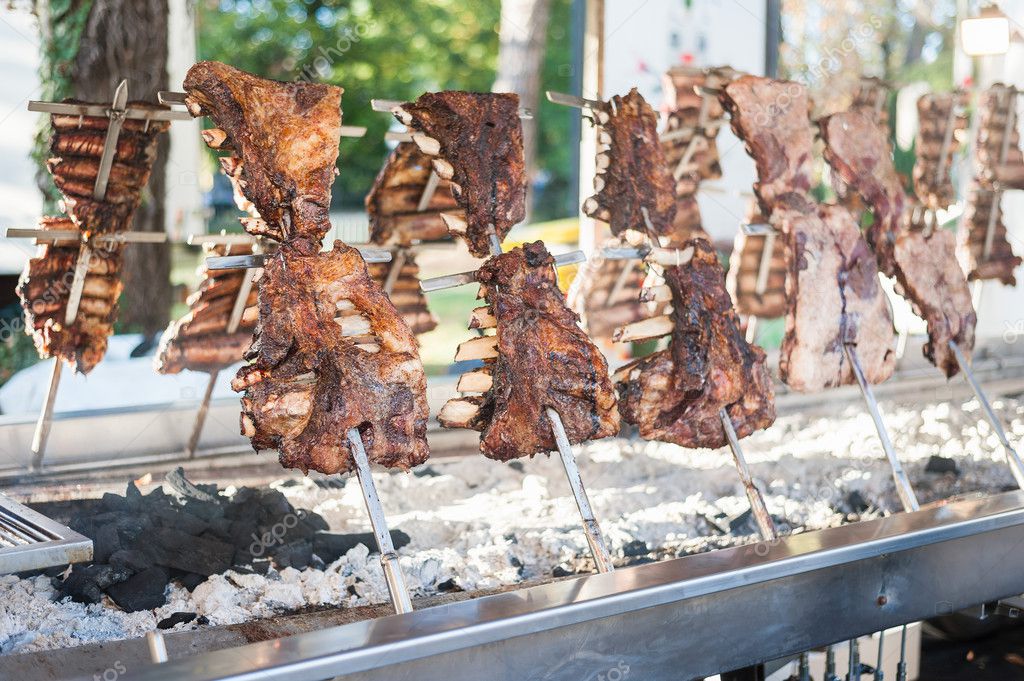 Traditional Argentinian asado roasted lamb grilled meat. — Stock Photo
