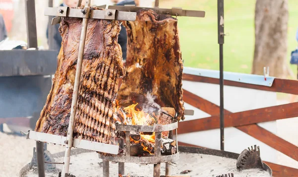 Traditional Argentinian asado roasted lamb grilled meat. — Stock Photo, Image