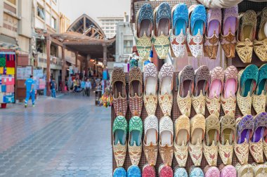 Colorful shoes in souk Dubai. clipart