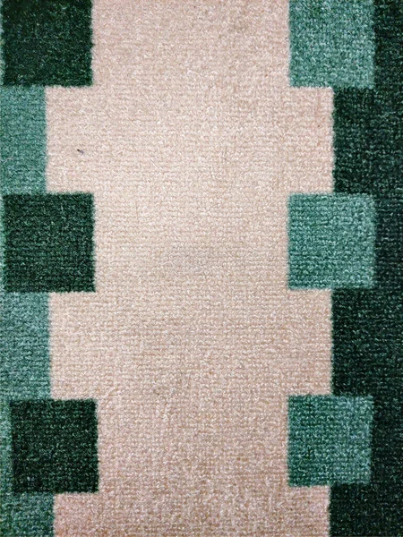 Kare ve bej arkaplanlı yeşil halı