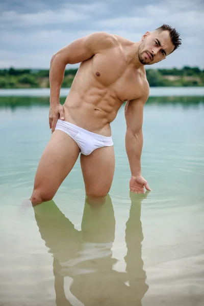 Sexy Sports Man Macho White Shorts Bodybuilder Stands Beautiful Water — Stock Photo, Image