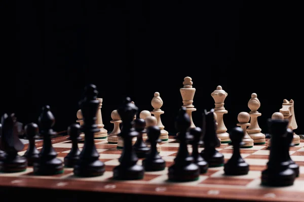 stock image Chess board with large wooden chess pieces