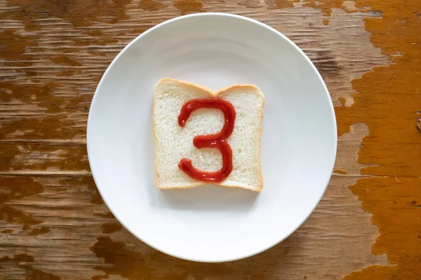bread of breakfast is written number 3 by ketchup on write plate. A to Z and Number and Special characters set.