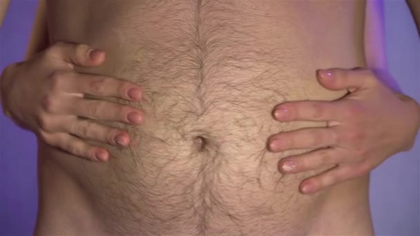 Close up of woman touching hairy belly of husband and then puts hands down below belt. Concept of family relationships — Stock Video