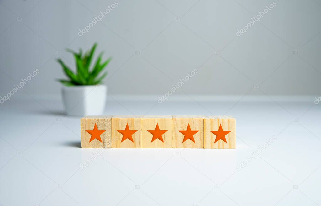 wooden five star shape on table. Best Excellent Services Rating for Satisfaction.