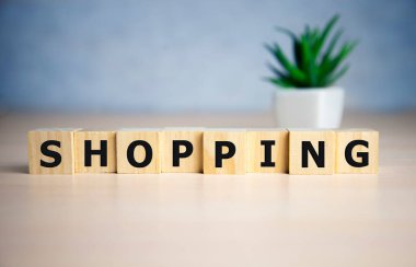 Alışveriş kelimesi, mavi arkaplan ile kelime küpü.