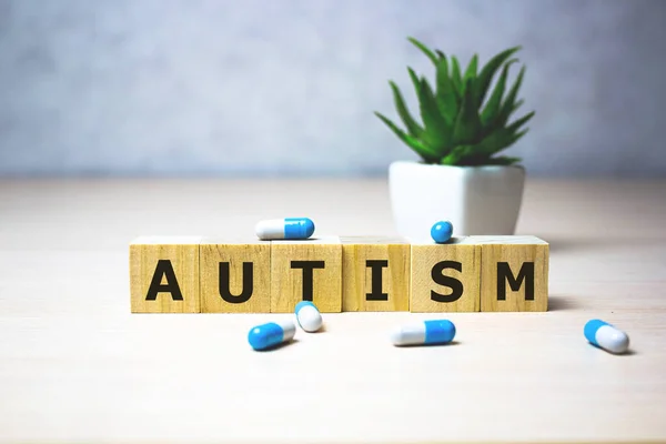 Autism - word from wooden blocks with letters, autism spectrum disorder ASD concept. medical business concept, background.. Healthcare conceptual for hospital, clinic and medical business.