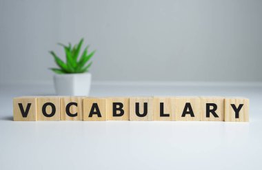 Vocabulary word on wooden cubes, english concept clipart