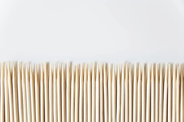 Wooden Toothpicks Row Look Fence White Background — Stock Photo, Image