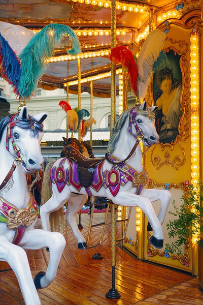 horses on a old-fashioned carousel