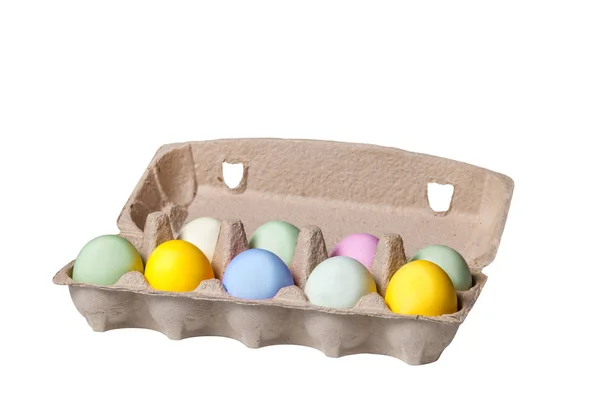 Colorful Easter eggs in a cardboard tray on wooden background Stock Picture