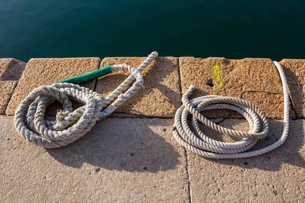 Two White Strong Ropes Rolled Spiral Port Mediterranean Sea Water — Stock Photo, Image