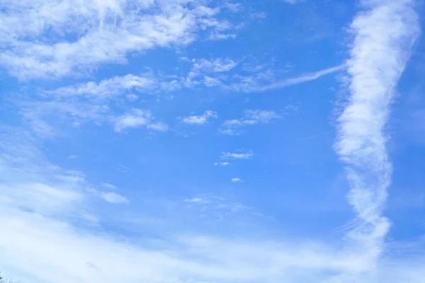 Blue sky and puffy clouds