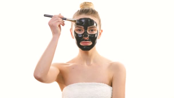 Happy Woman Applying Skin Care Face Mask White Background — Stock Video