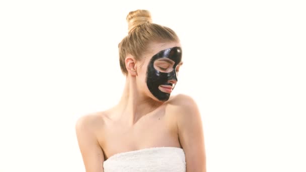 Cute Woman Black Face Care Mask Gesturing White Background — Stock Video