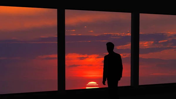 Mannen Som Står Nær Panoramautvinduet Den Vakre Solnedgangen – stockfoto