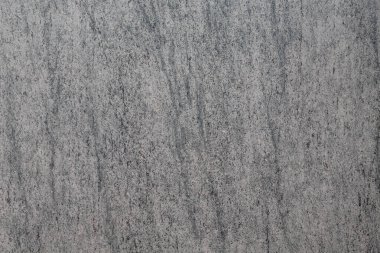 desenleri ve soyutlamaları olan gri beton duvar