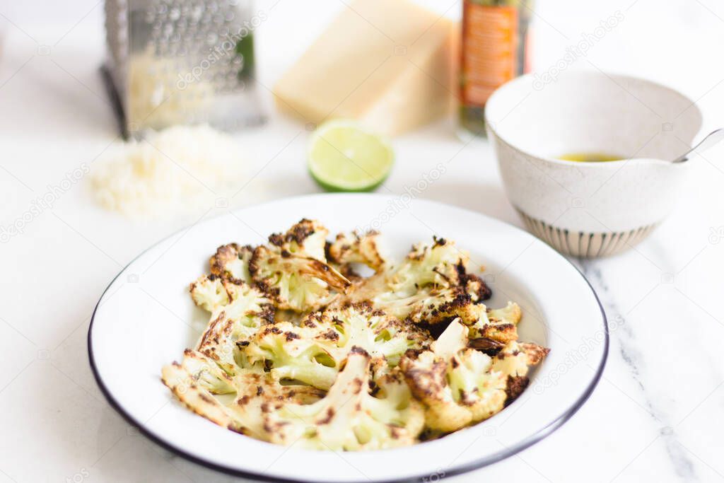Roasted cauliflower with parmesan and lime juice.