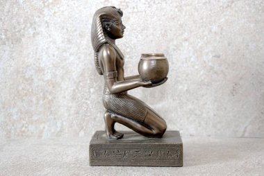 Amenhotep II offering two glasses of wine to a god, statue   clipart
