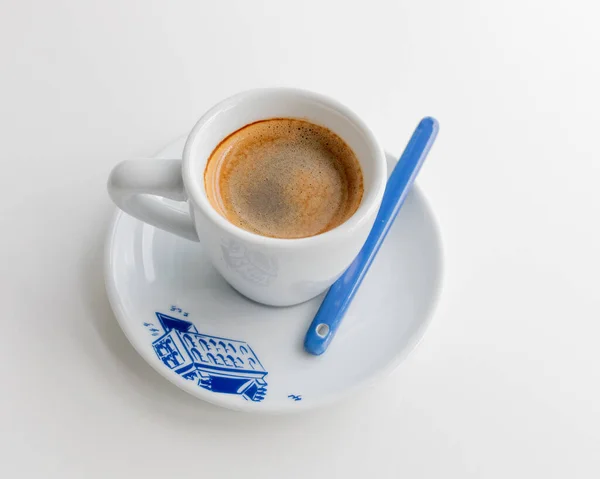 Espresso in a white cup with a blue print in the morning