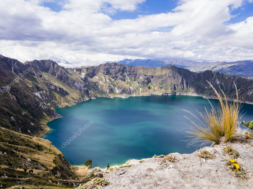 Turquoise waters of Quilotoa lagoon, volcanic crater lake in Ecuador