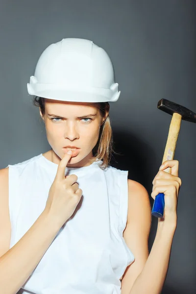 Young girl with hammer instrument — Stok fotoğraf