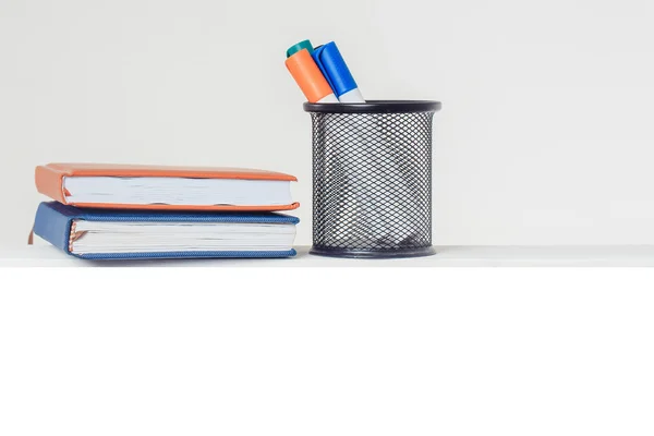 Markers in stand with notebooks — Stock Photo, Image