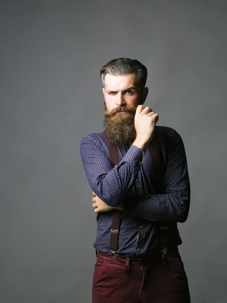 Hombre guapo hipster gira bigote — Foto de Stock