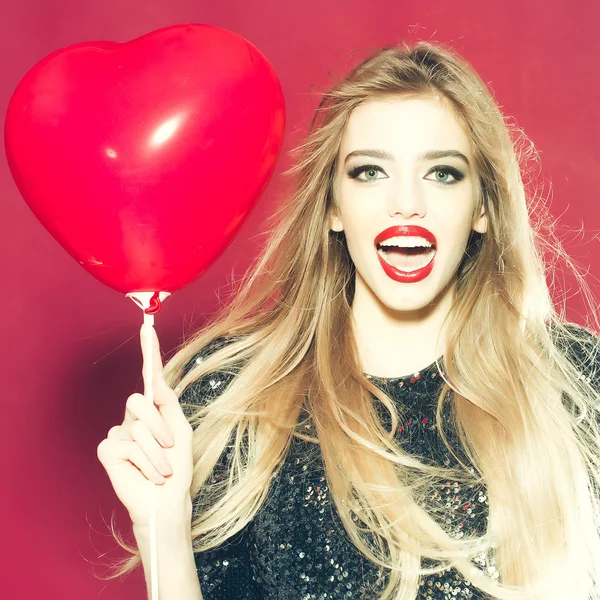 Emotional woman with heart balloon — Stock Photo, Image