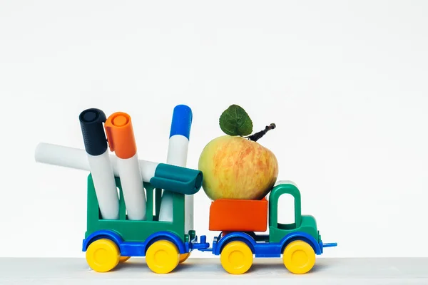 Toy car with apple and trailer
