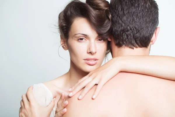 Young sexy couple in studio — Stock Photo, Image