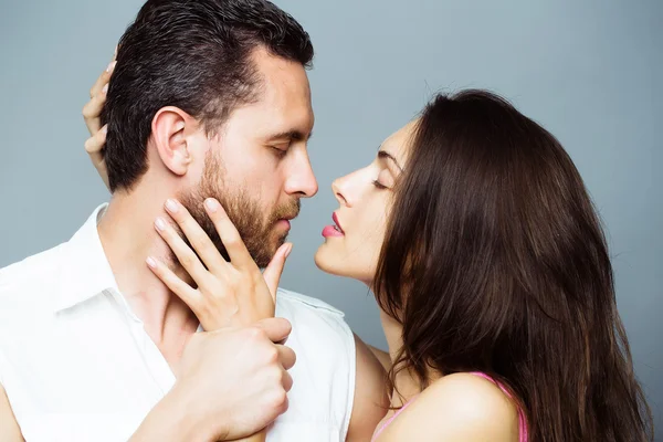 Young sexy couple in studio — Stock Photo, Image