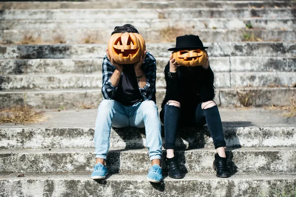 Halloween couple with pumpkin — Stock Photo, Image