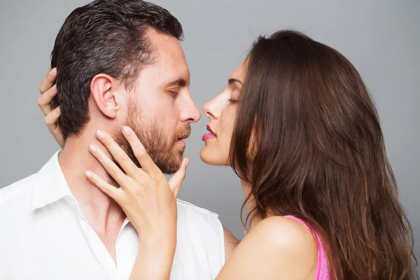 Young sexy couple in studio — Stock Photo, Image